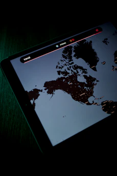 Underground scanning equipment displaying a digital map overlay on a dark, textured background.