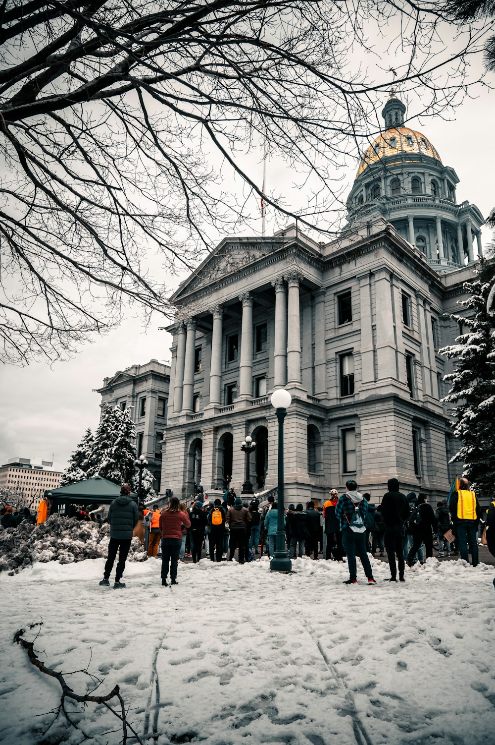 people standing in front of white concrete building during daytime