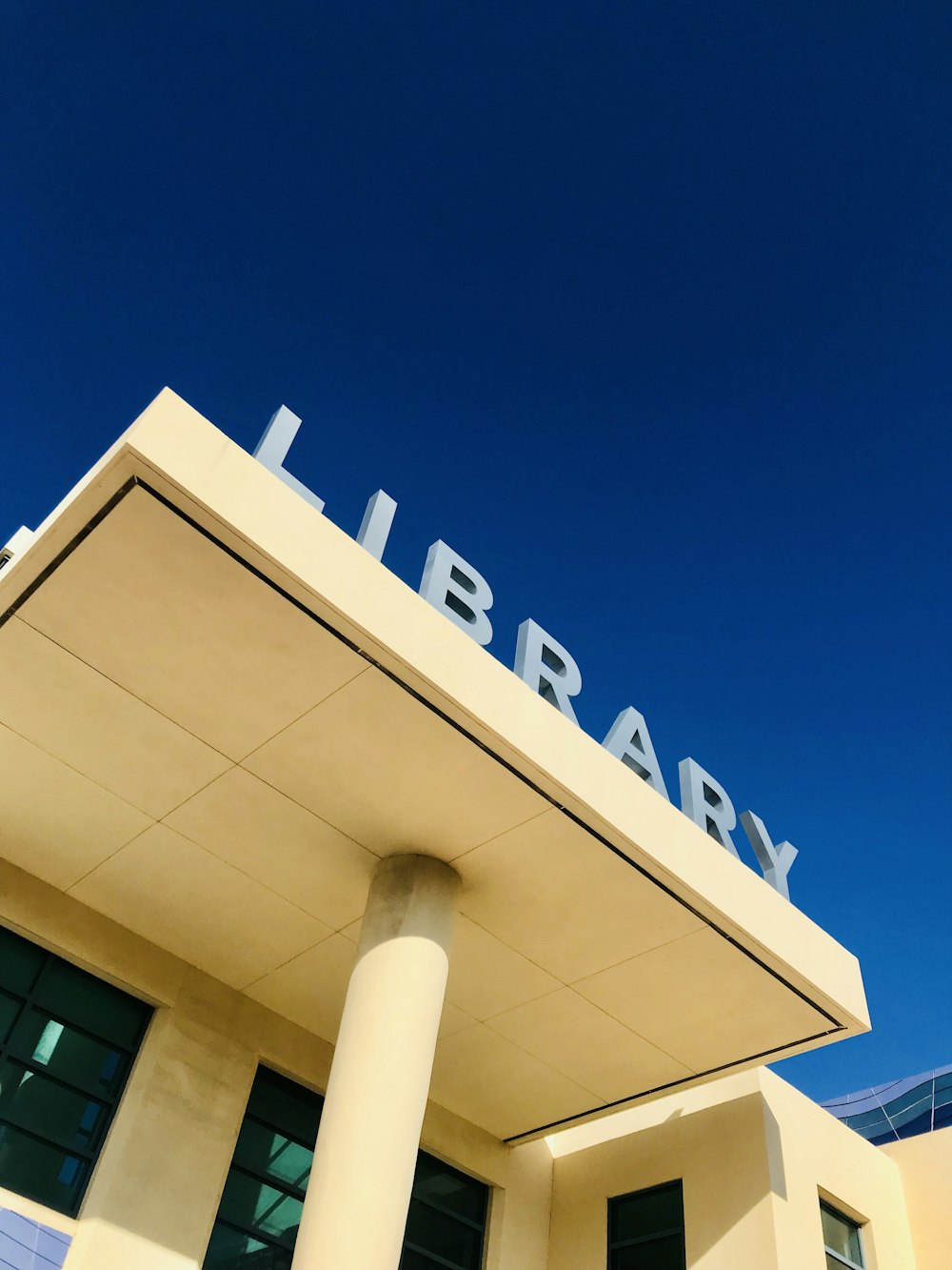 white concrete building under blue sky during daytime