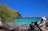 A scenic view of a tropical beach with clear blue water.