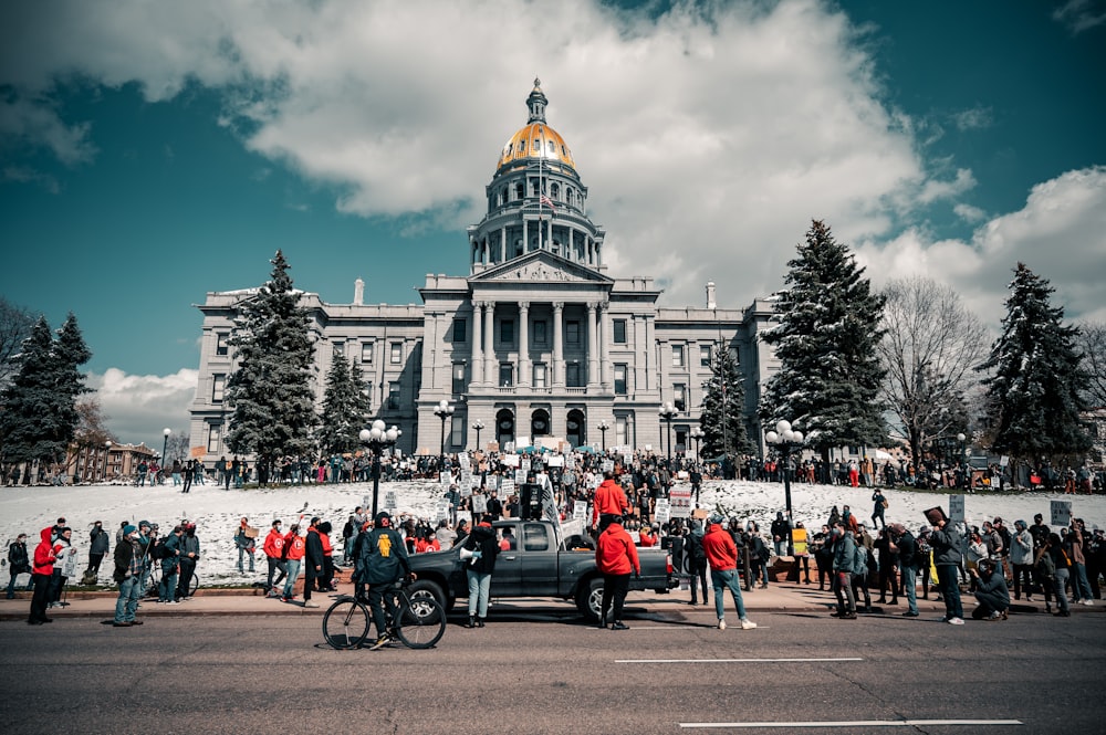 people in front of white building during daytime