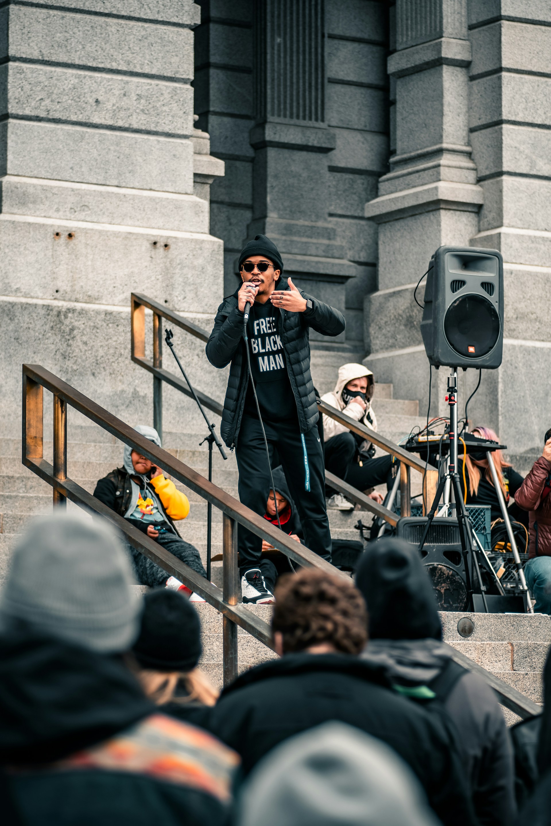 woman wearing yellow long-sleeved dress under white clouds and blue sky during daytime