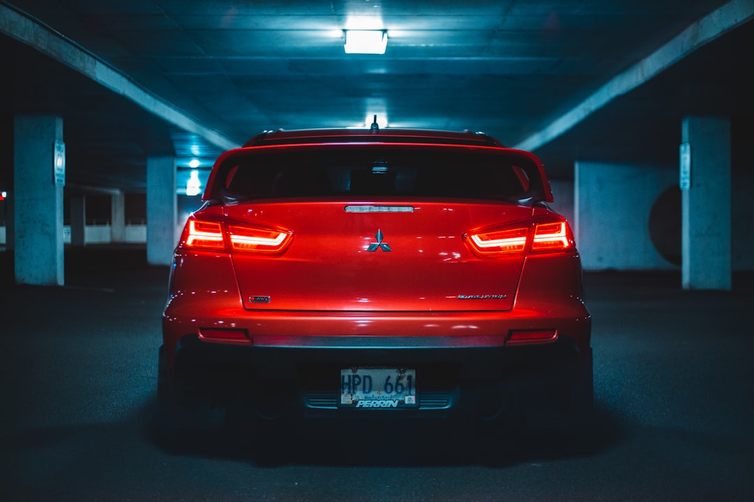 red car in a parking lot