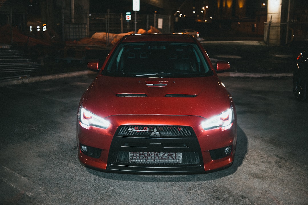 red audi car on road during night time