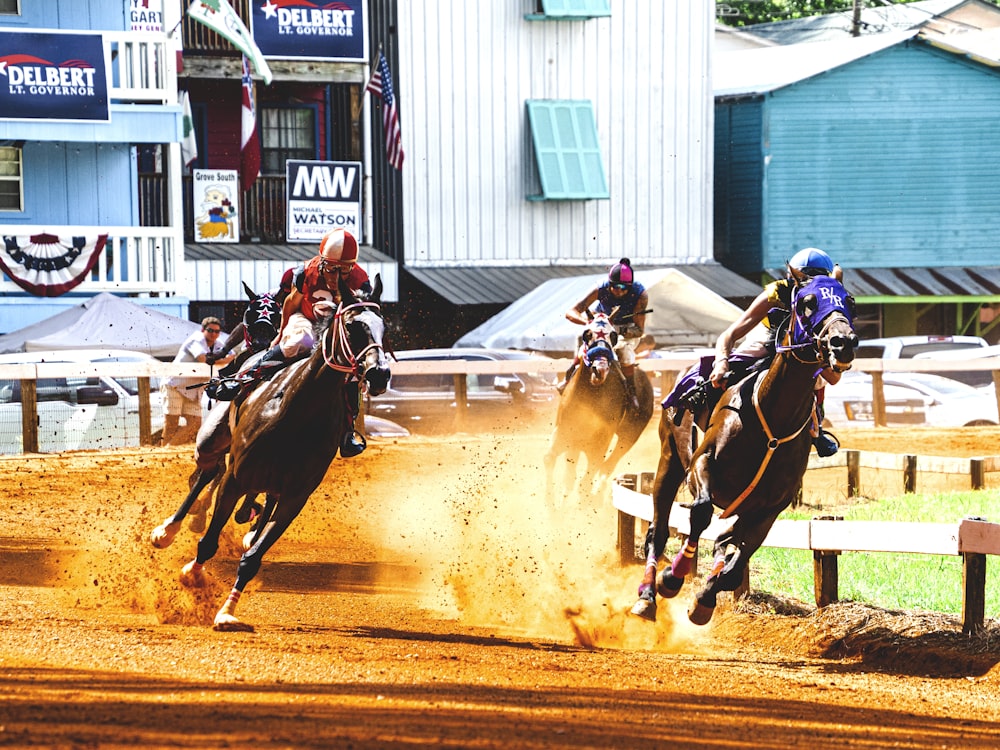 man riding horse racing during daytime