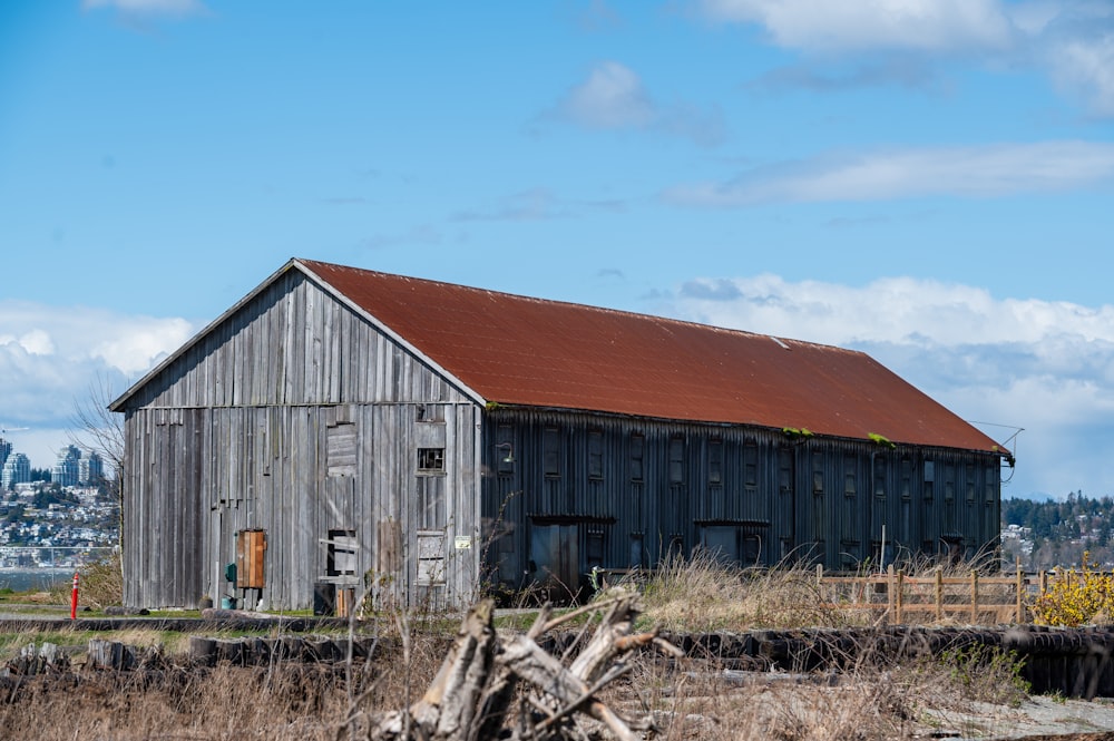 brown wooden barn under blue sky during daytime