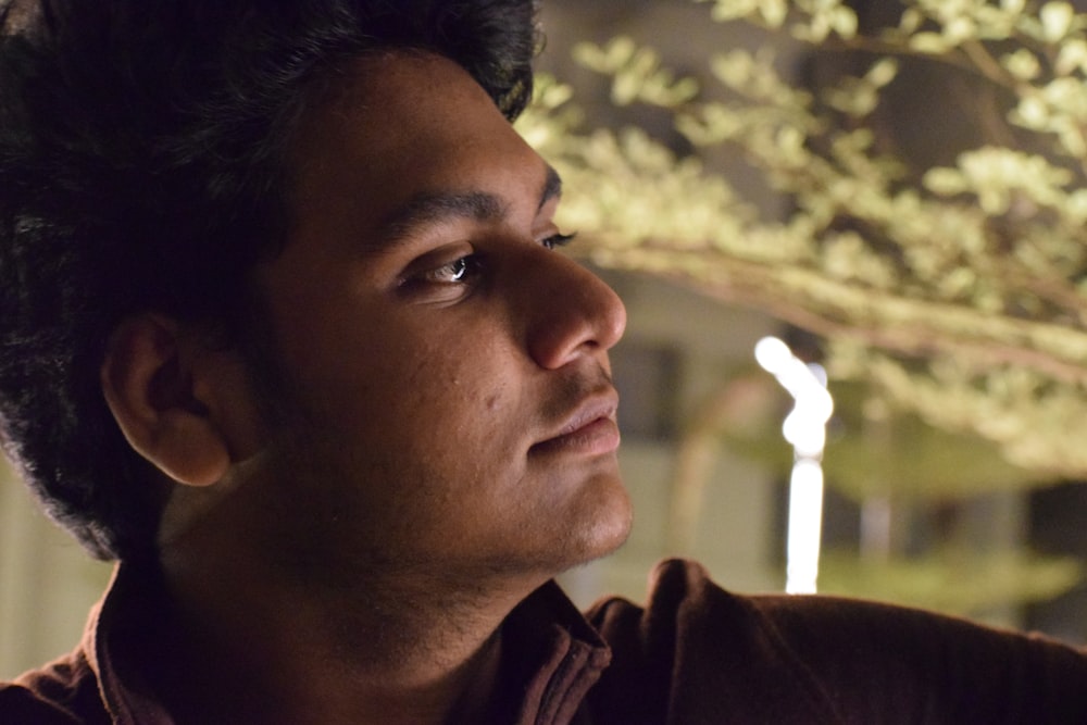 man in brown collared shirt