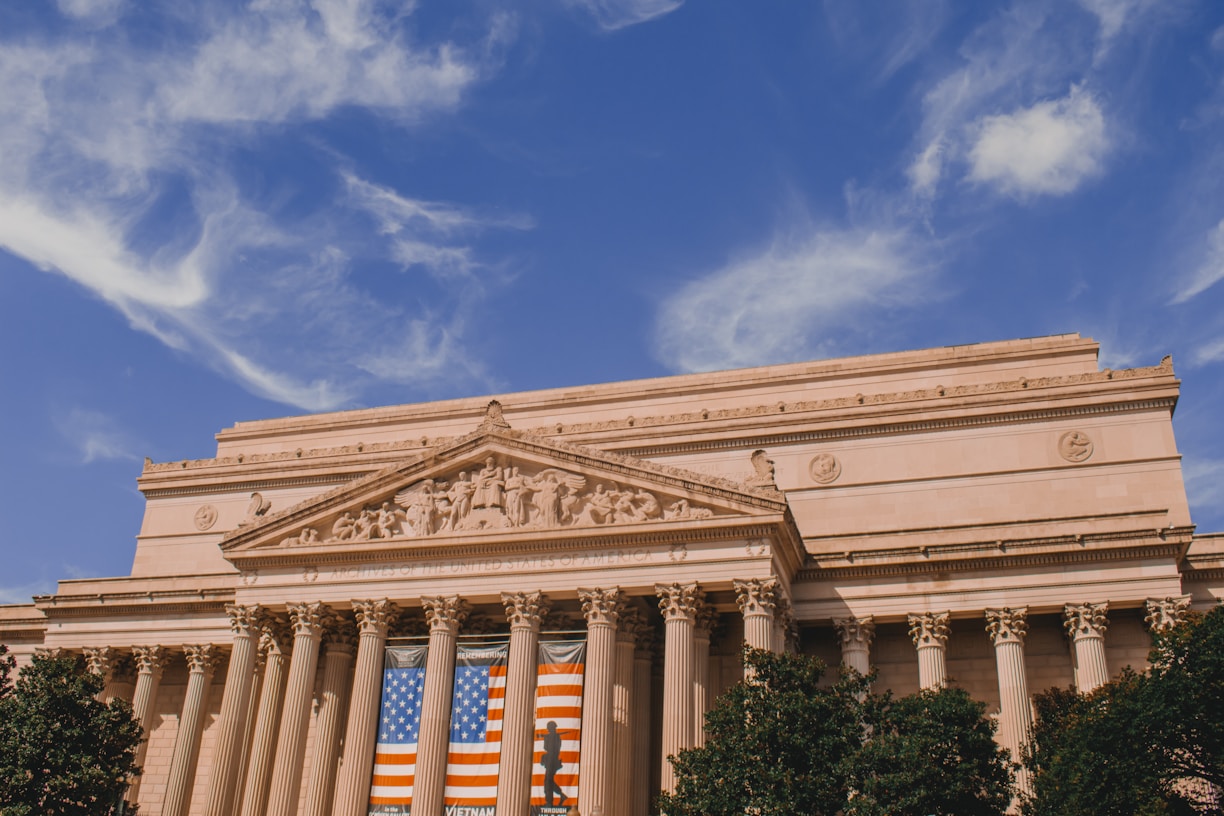 white and brown concrete building under blue sky during daytime
