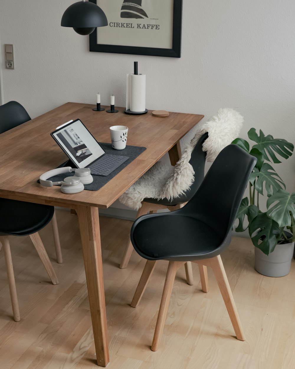 black and silver laptop computer on brown wooden table