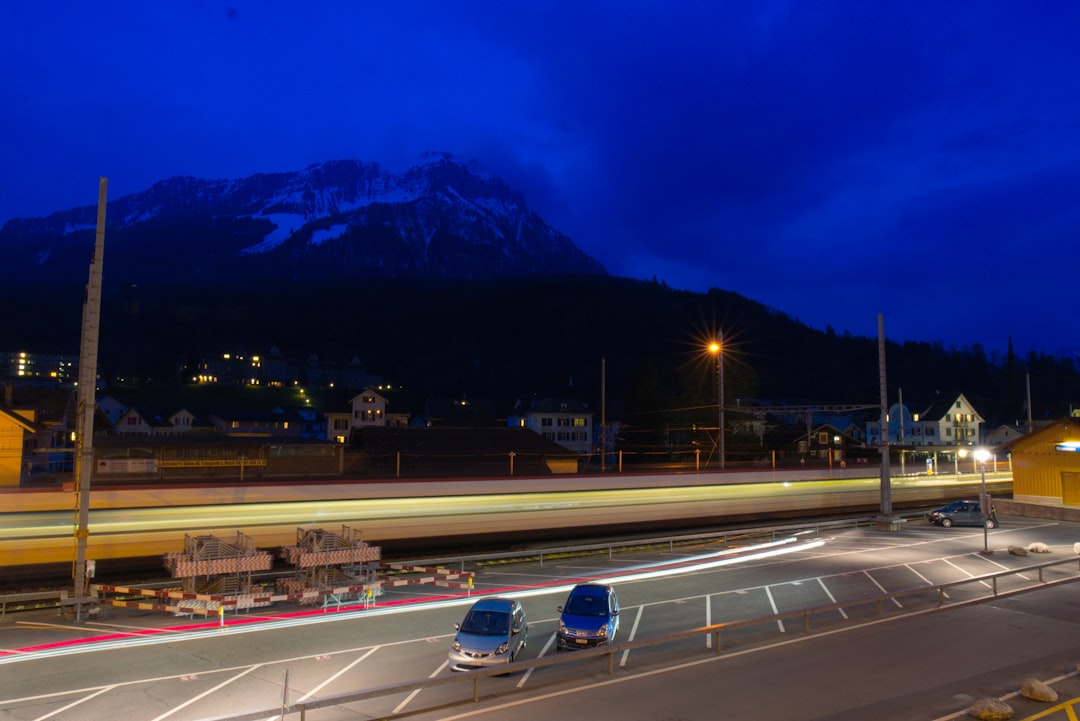 white car on road during night time