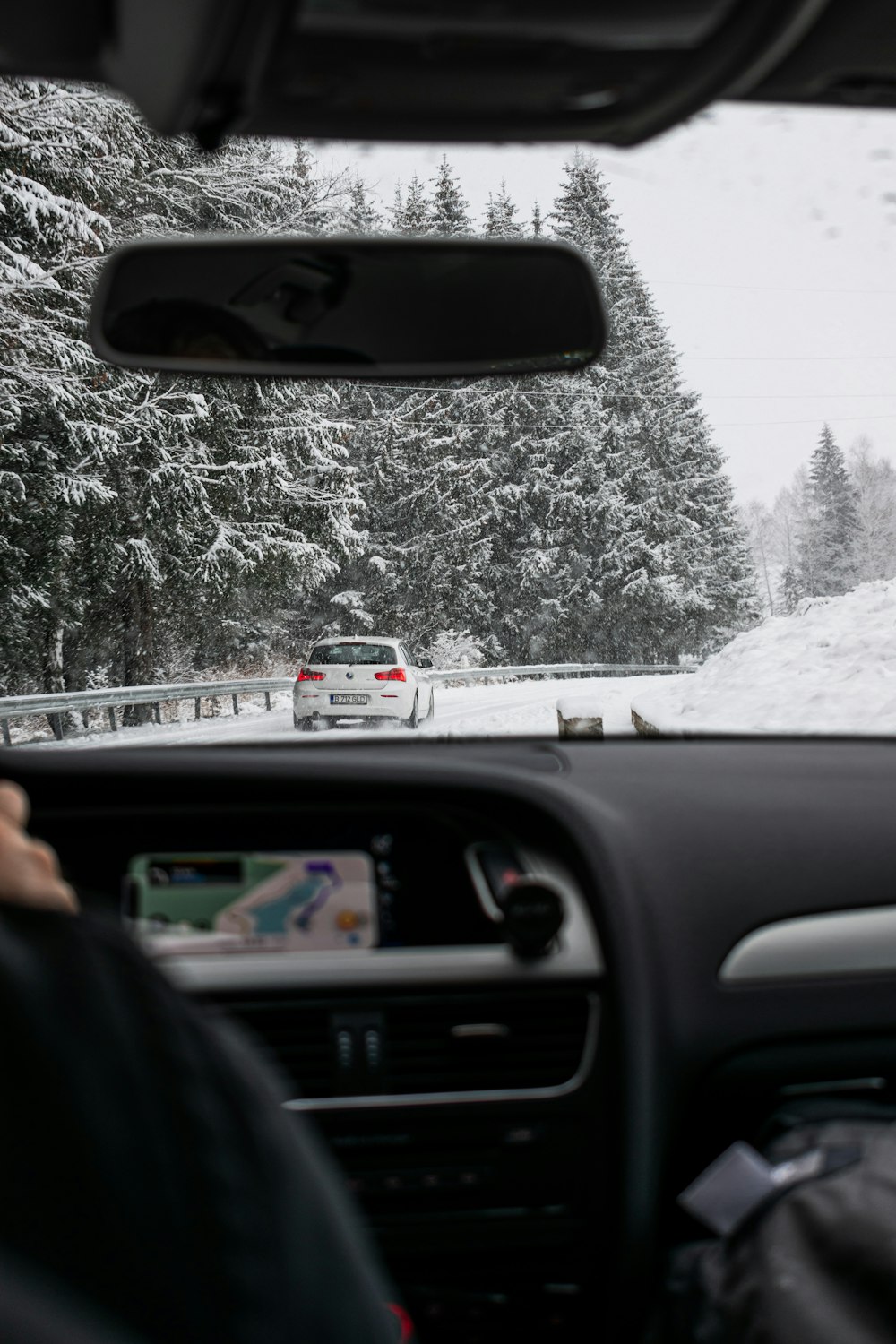 person in black jacket driving car during daytime