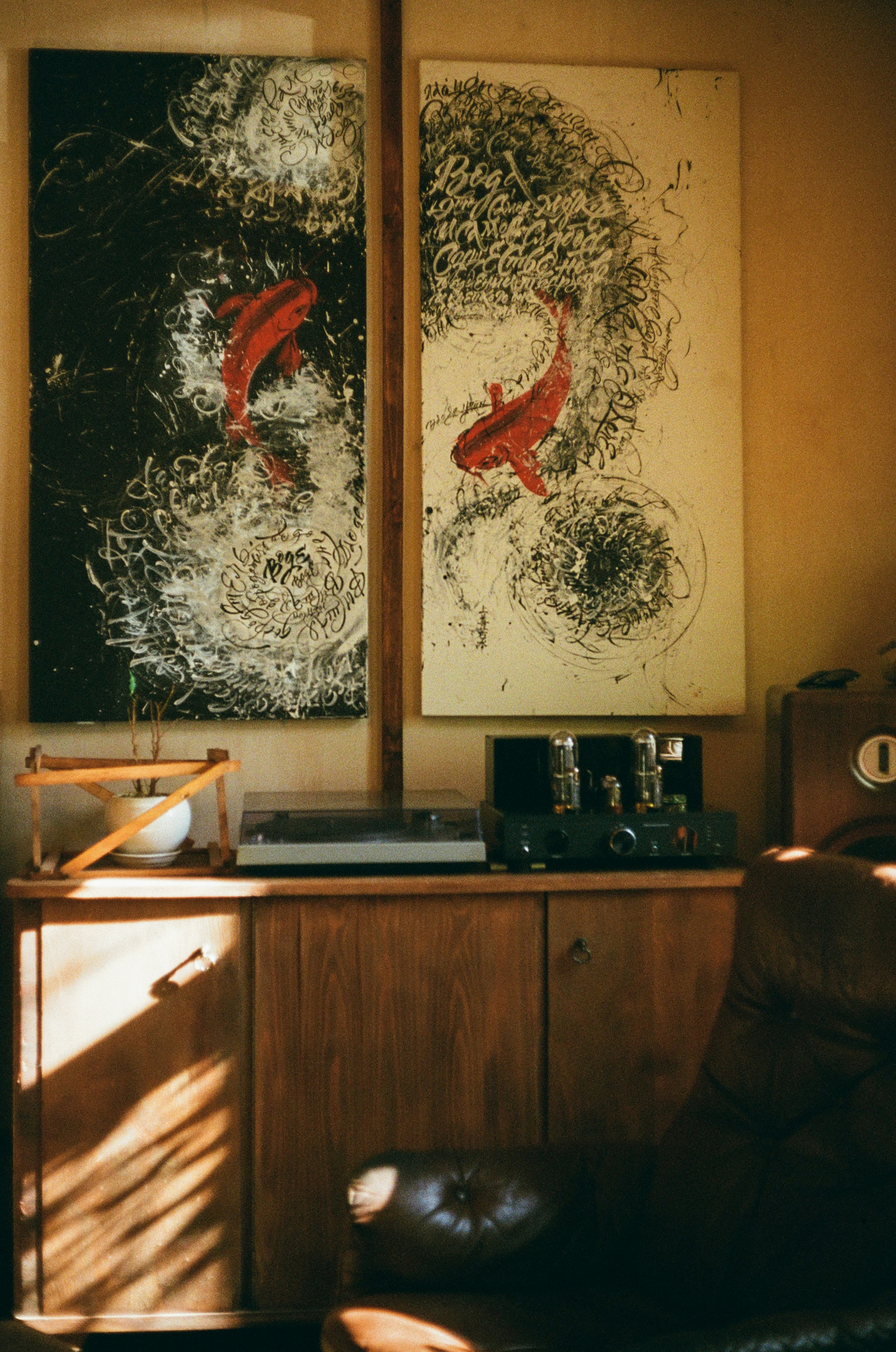brown wooden desk with black and silver radio