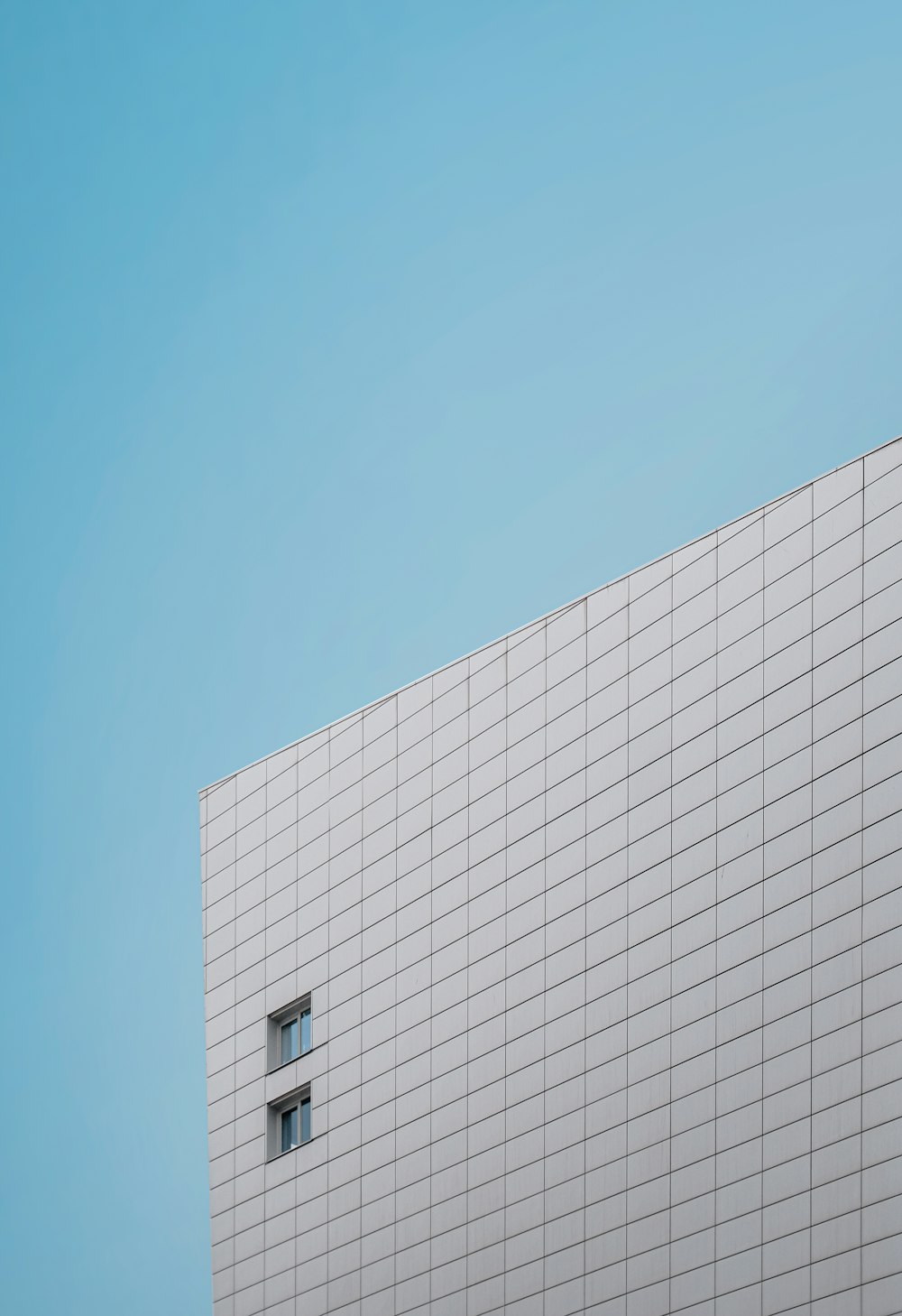 white concrete building under blue sky during daytime