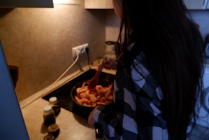 Chef preparing a delicious shrimp dish in a kitchen