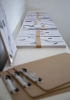 Printed HIPAA policy documents neatly organized on a dental practice desk.