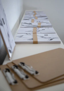 Printed HIPAA policy documents neatly organized on a dental practice desk.