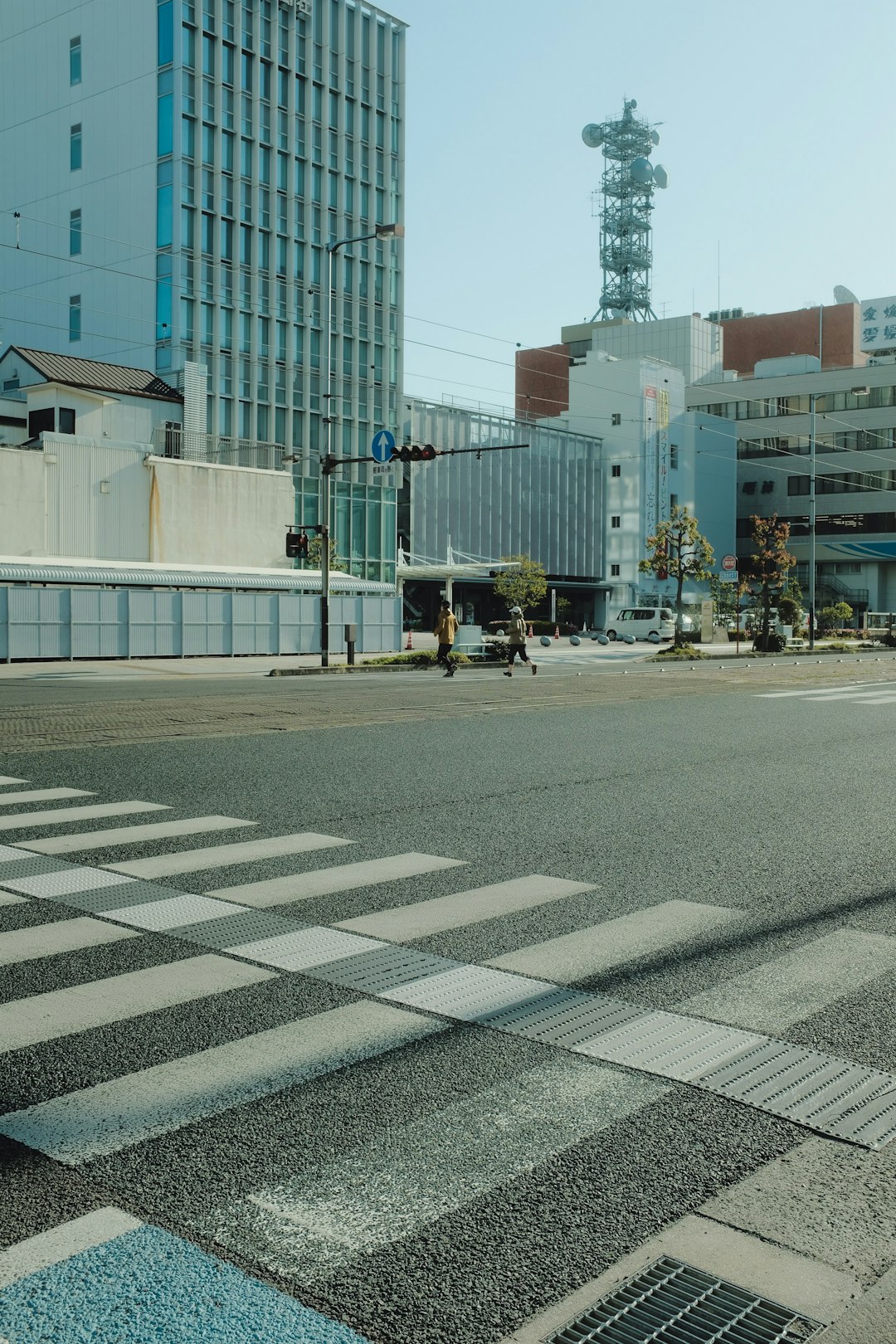 people walking on sidewalk near building during daytime