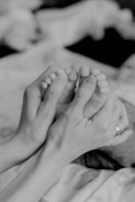 grayscale photo of persons feet