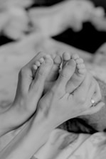 grayscale photo of persons feet