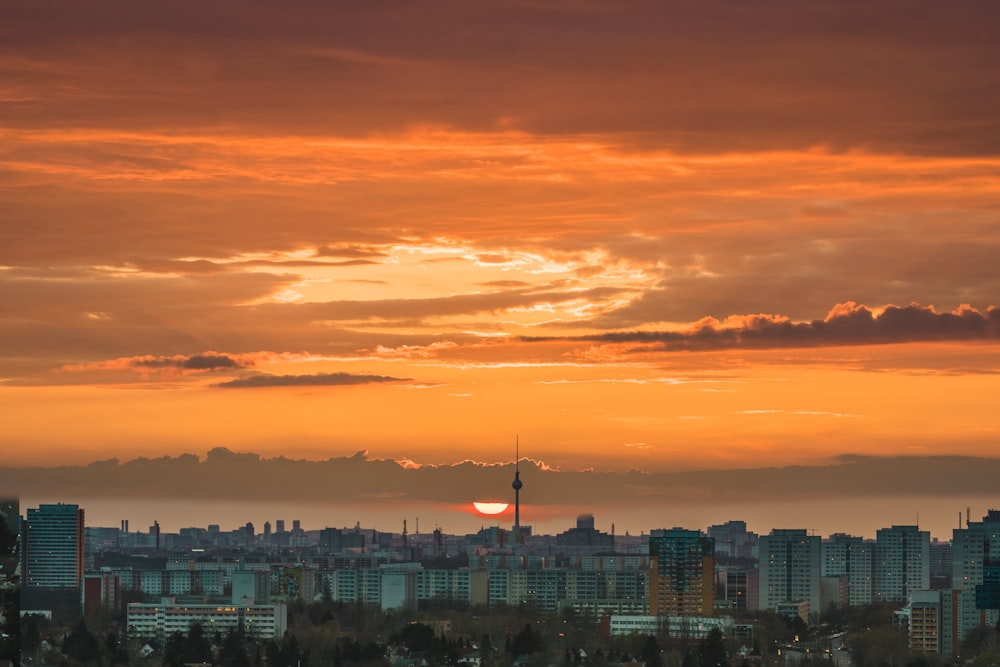city skyline during orange sunset