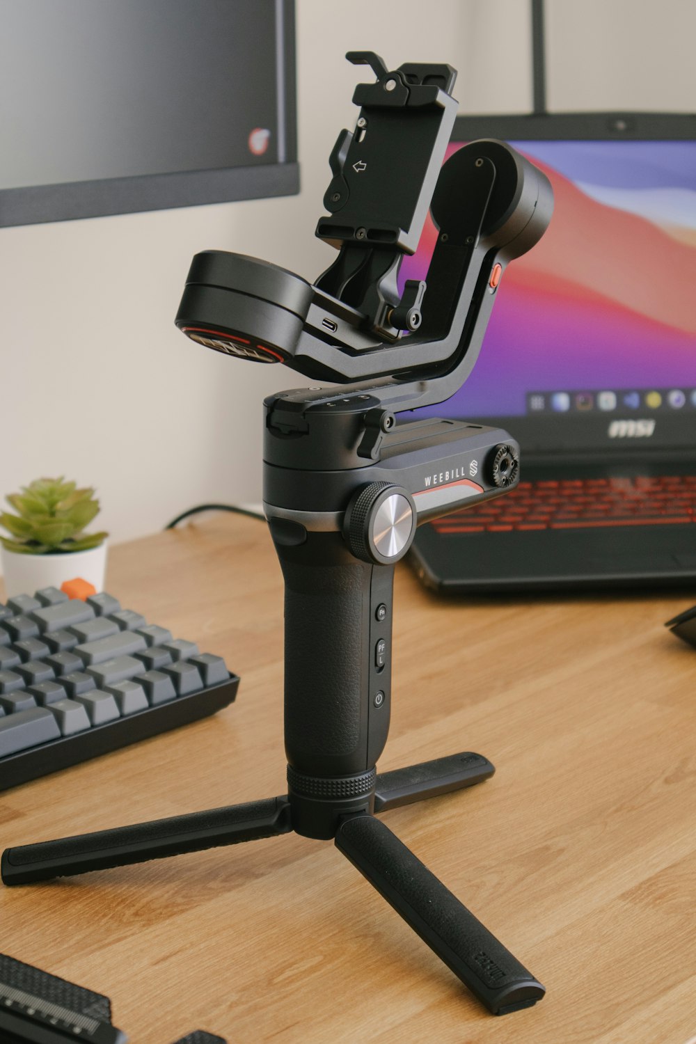 black microphone on brown wooden desk