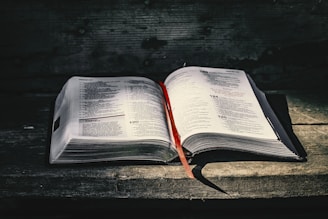 white book page on black wooden table