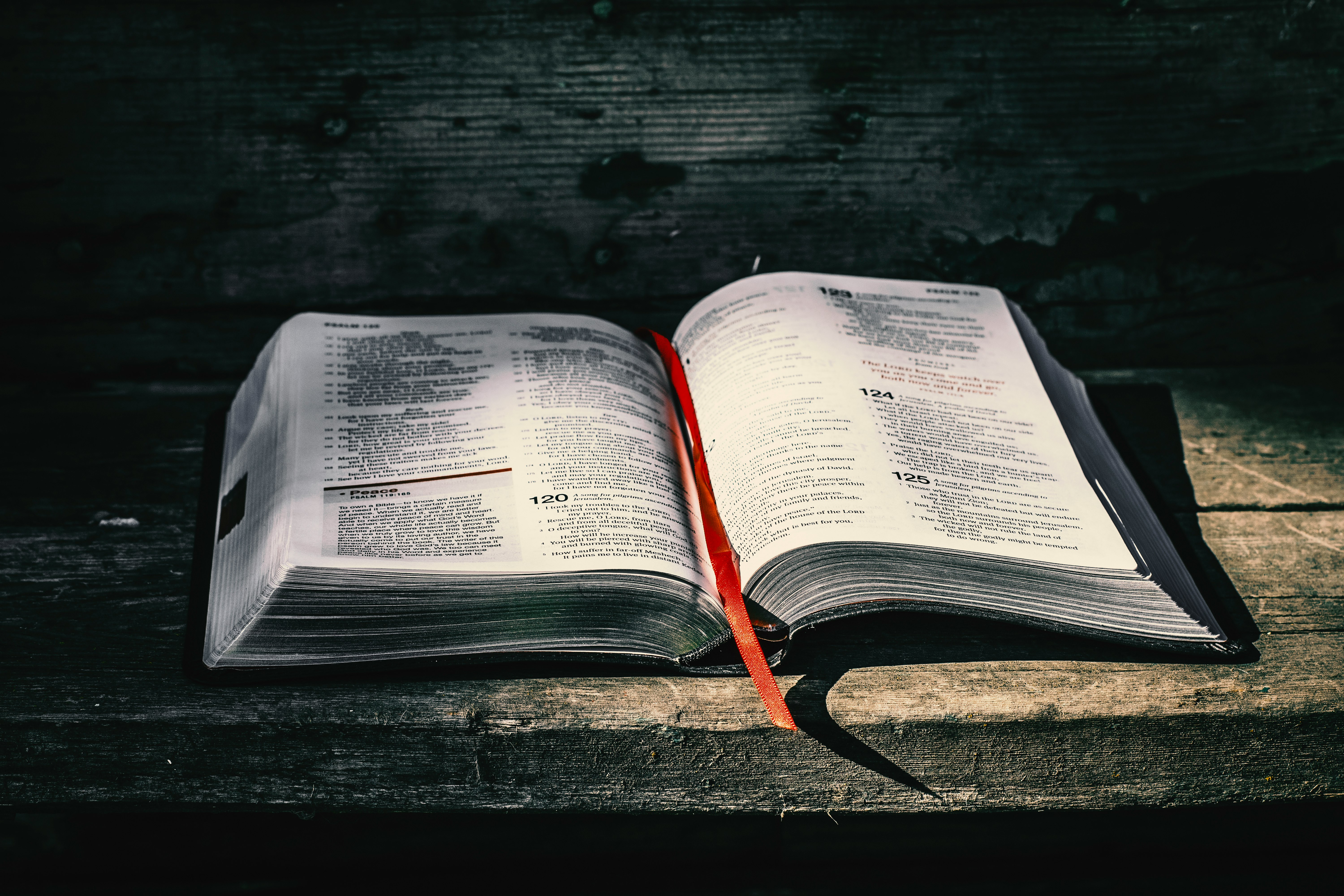 white book page on black wooden table