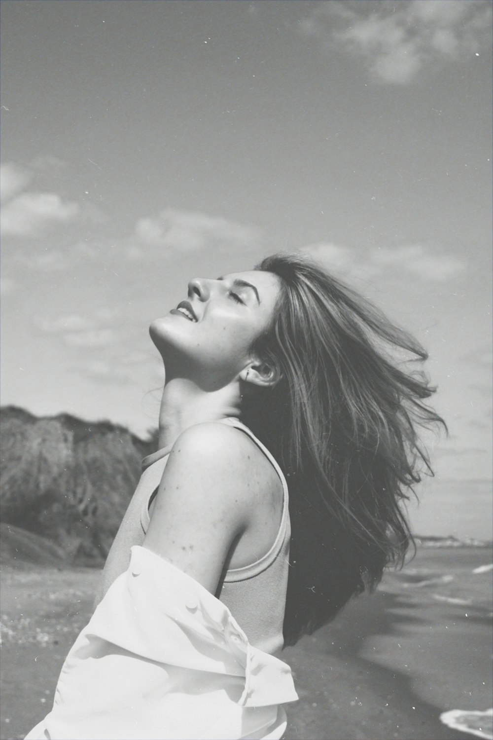 grayscale photo of woman in white off shoulder dress