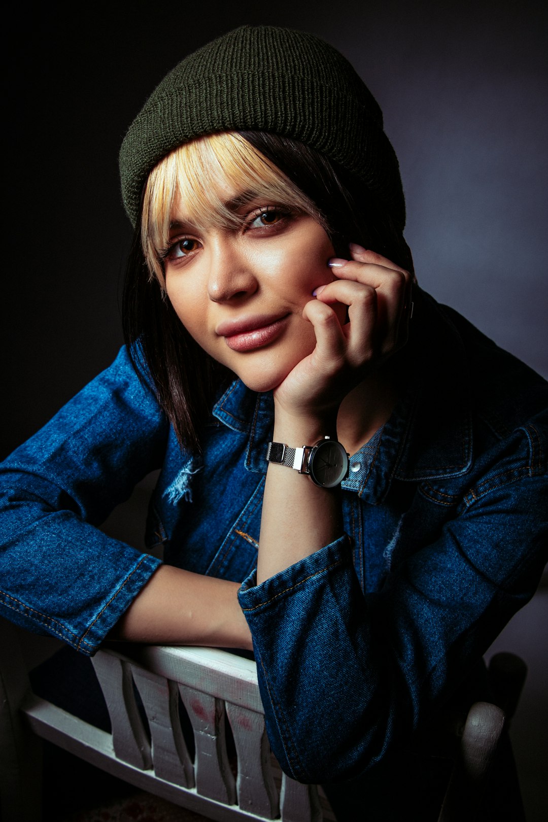 woman in blue denim jacket and black knit cap