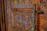 Close-up of a finely crafted wooden door with rich grain and vibrant color.