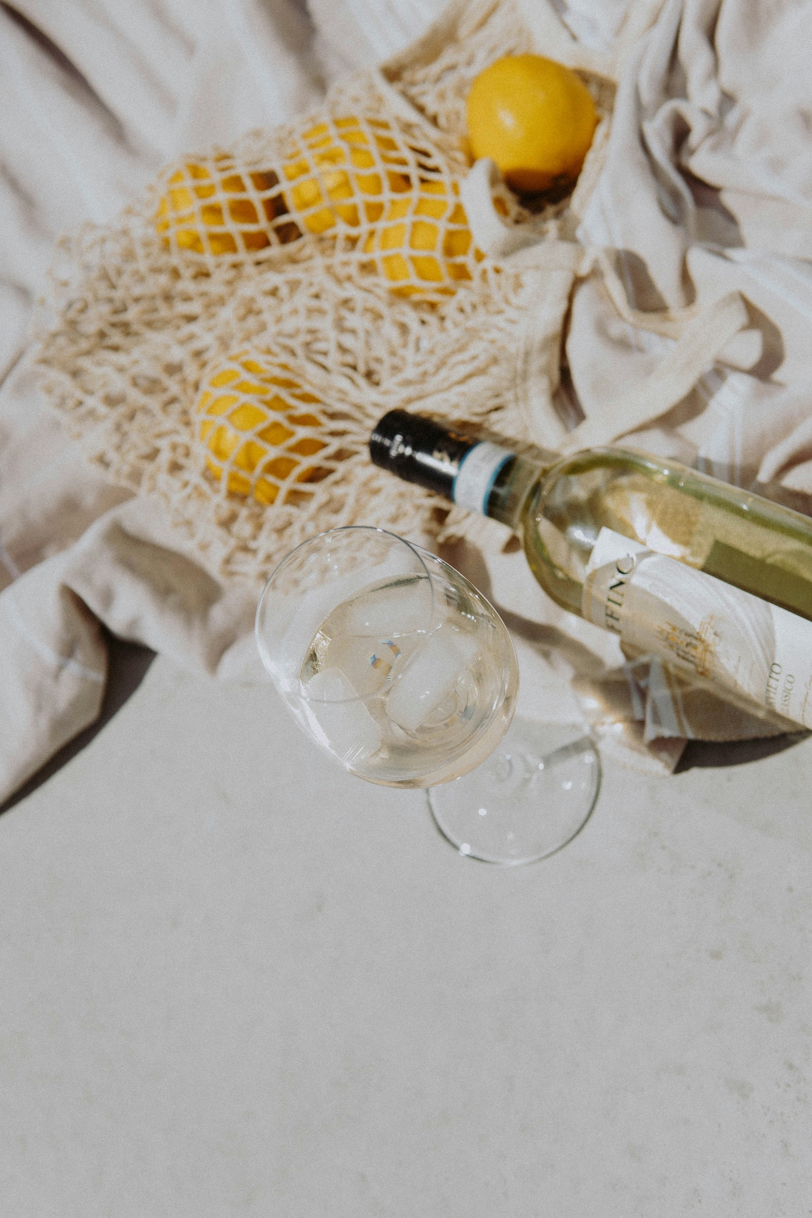 clear glass bottle beside clear drinking glass