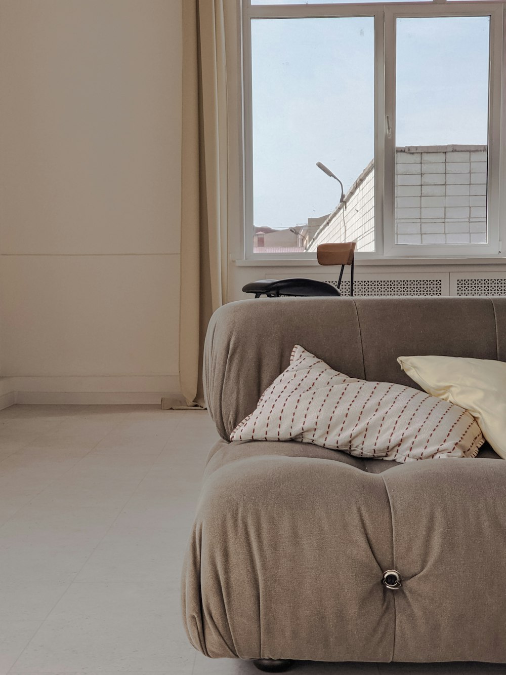 white and black pillow on bed