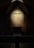 A serene church interior with soft lighting highlighting a simple wooden cross.