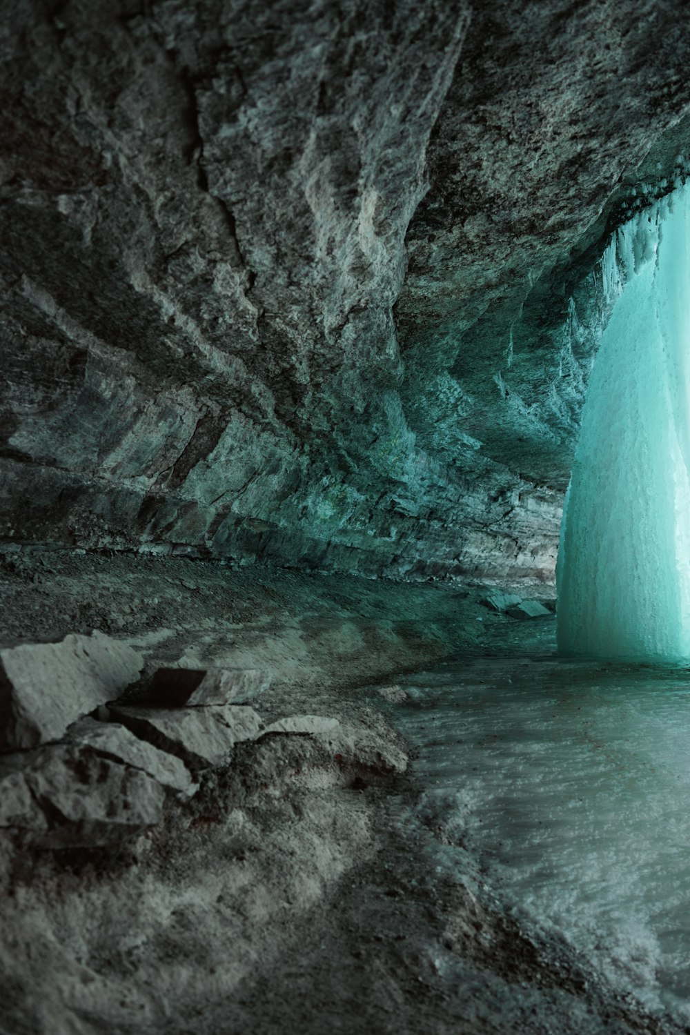 water falls in the middle of rocky mountains