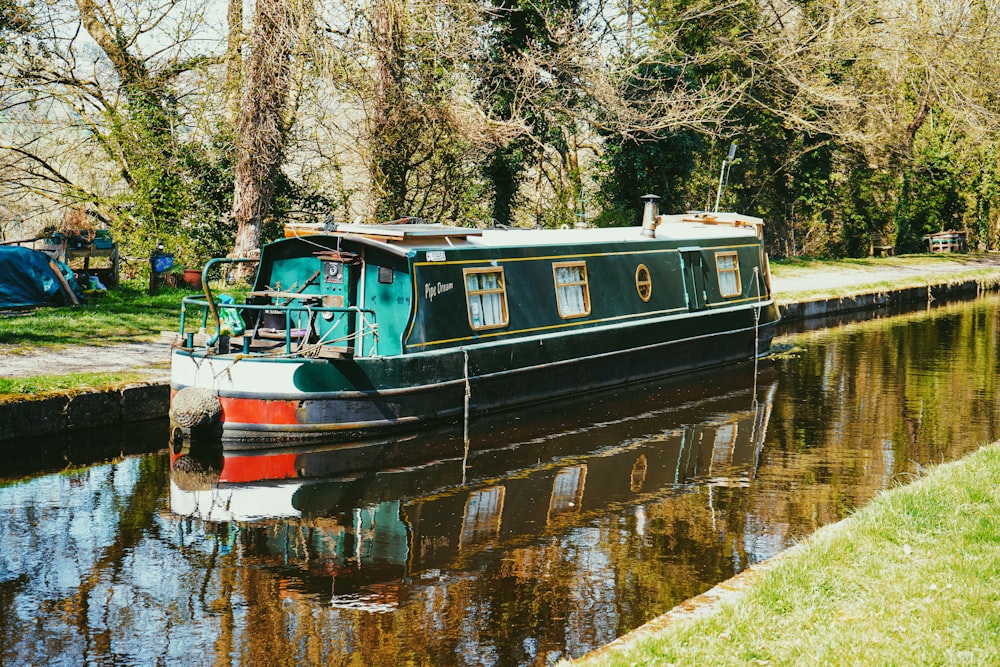 black and brown boat on river during daytime