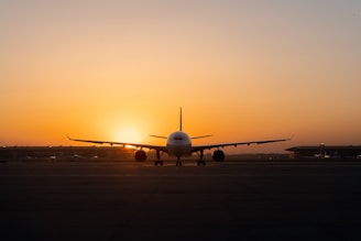 white airplane on airport during daytime