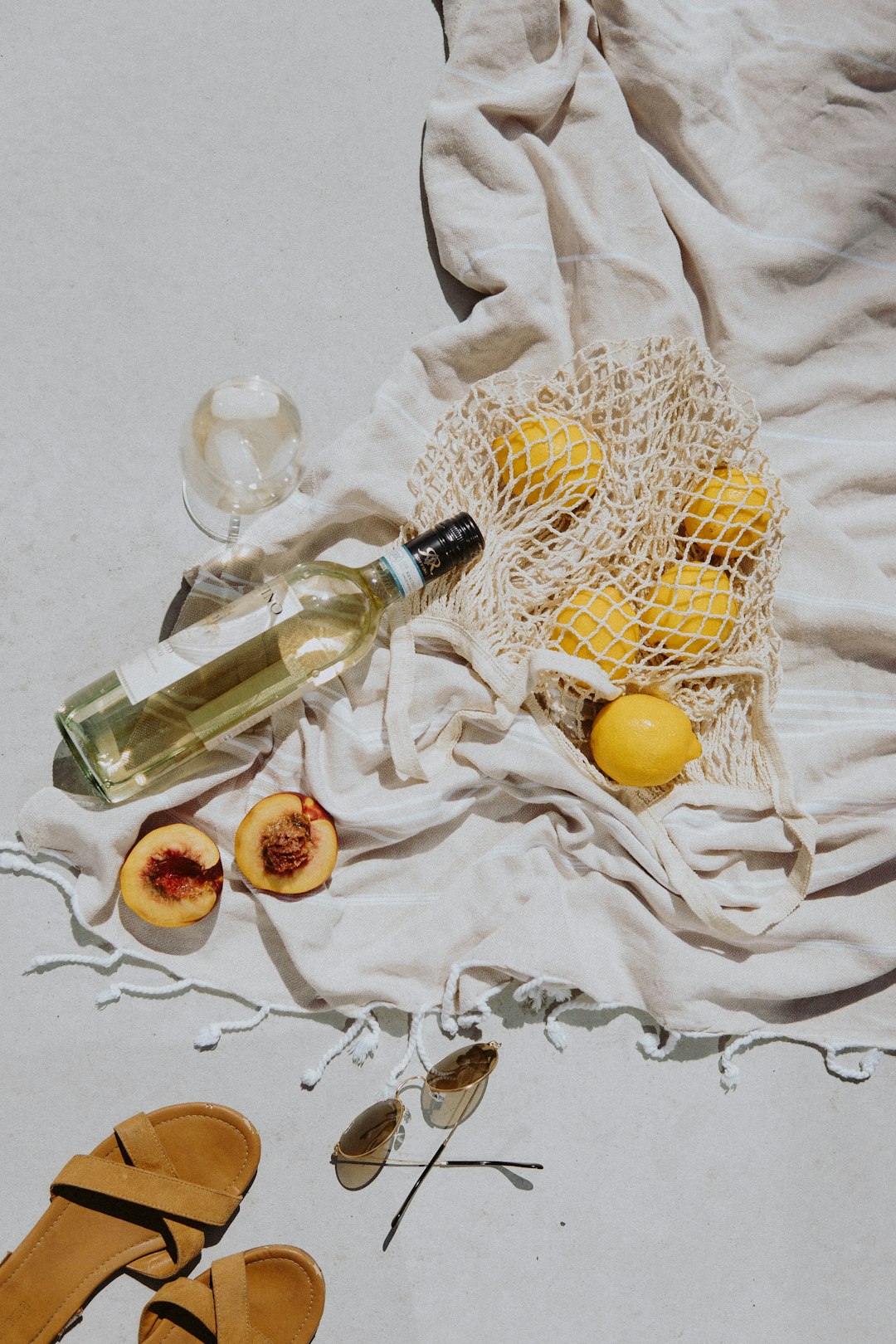 yellow and white round fruits on white textile