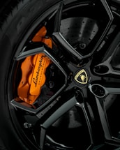 black and orange car wheel