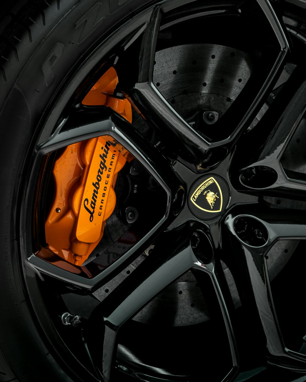 black and orange car wheel