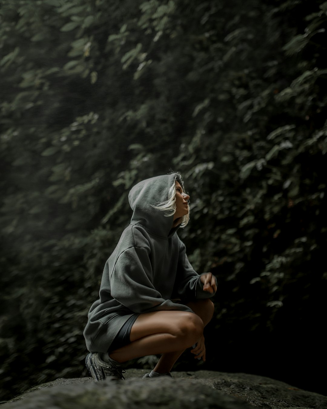 person in gray hoodie and black pants