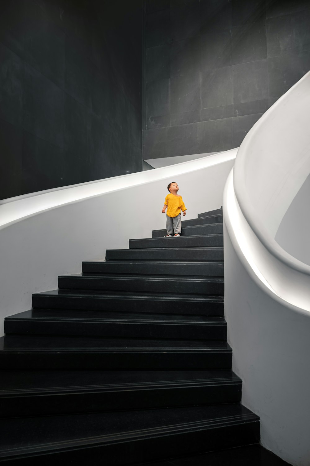 woman in yellow dress walking down the stairs