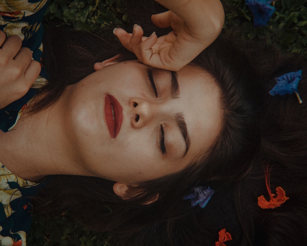 woman in black and blue floral shirt