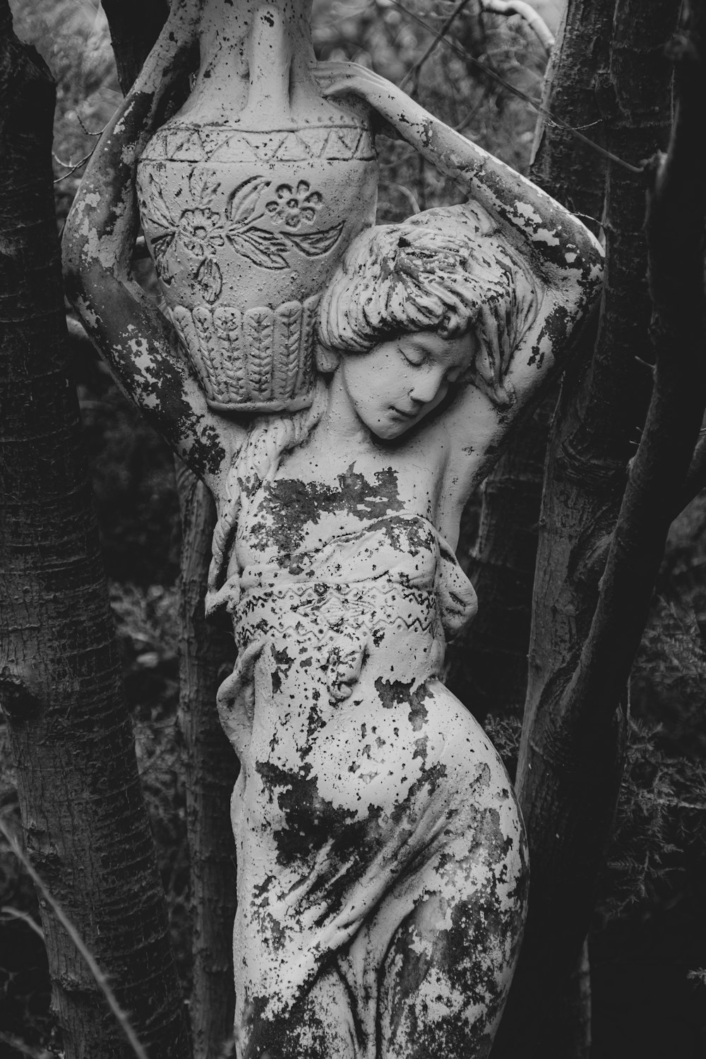 woman with floral headdress statue