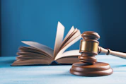 judges gavel and open book on table