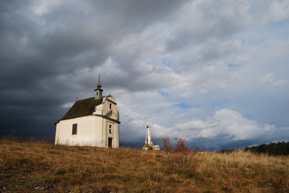 white and green cathedral under white clouds