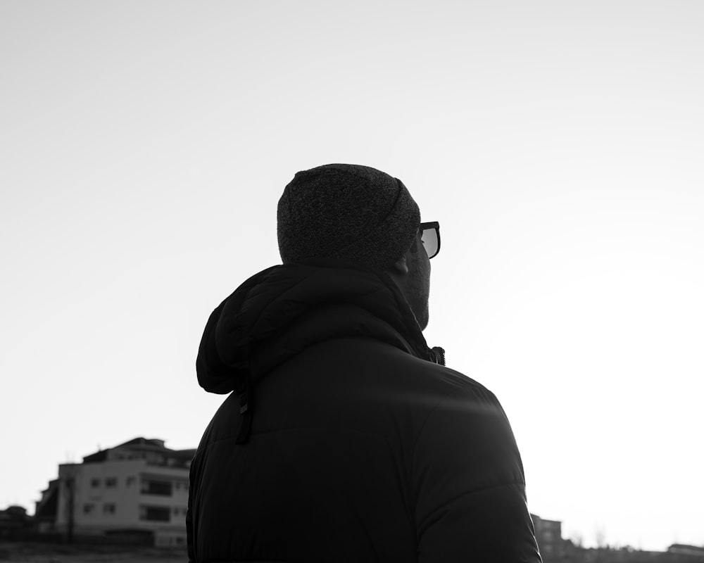 man in black hoodie standing during daytime