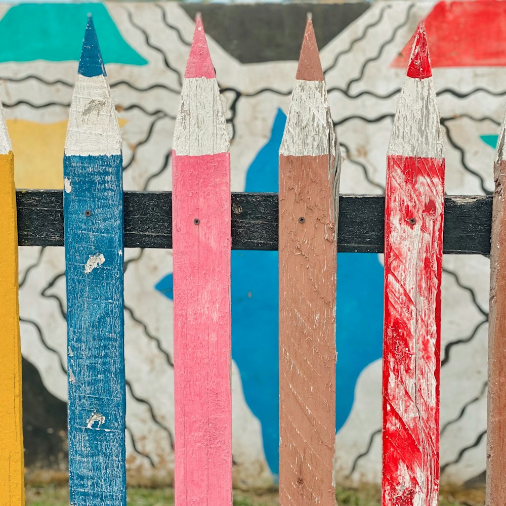 white red and blue striped wooden fence