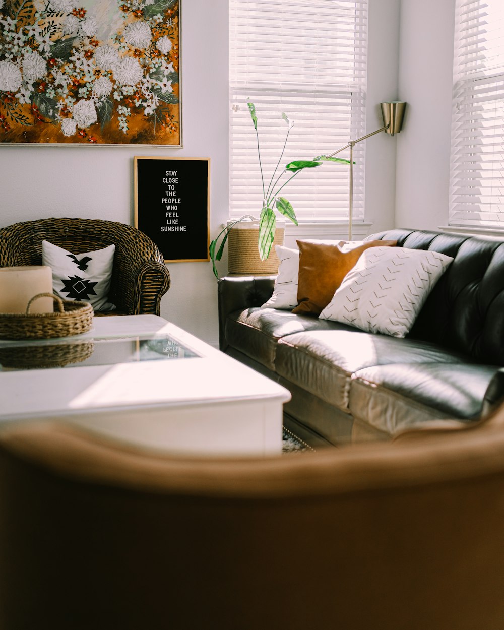 white and black throw pillows on white bed