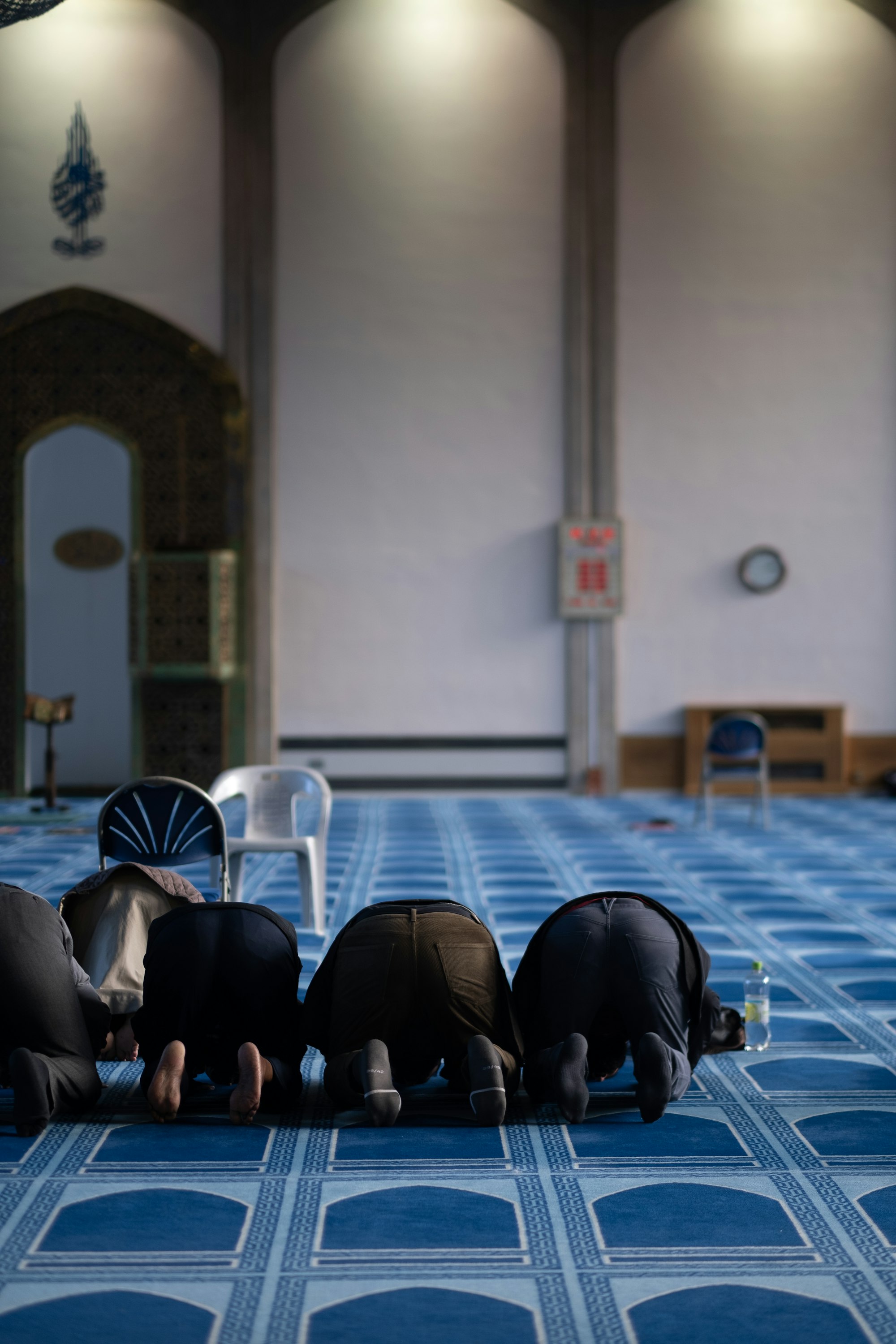Men praying at London Central Mosque.