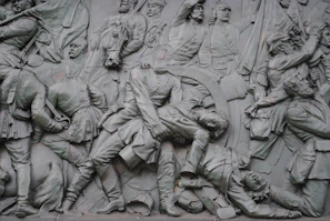 A dramatic depiction of the Siege of Jerusalem, with soldiers scaling walls amid smoke and chaos.